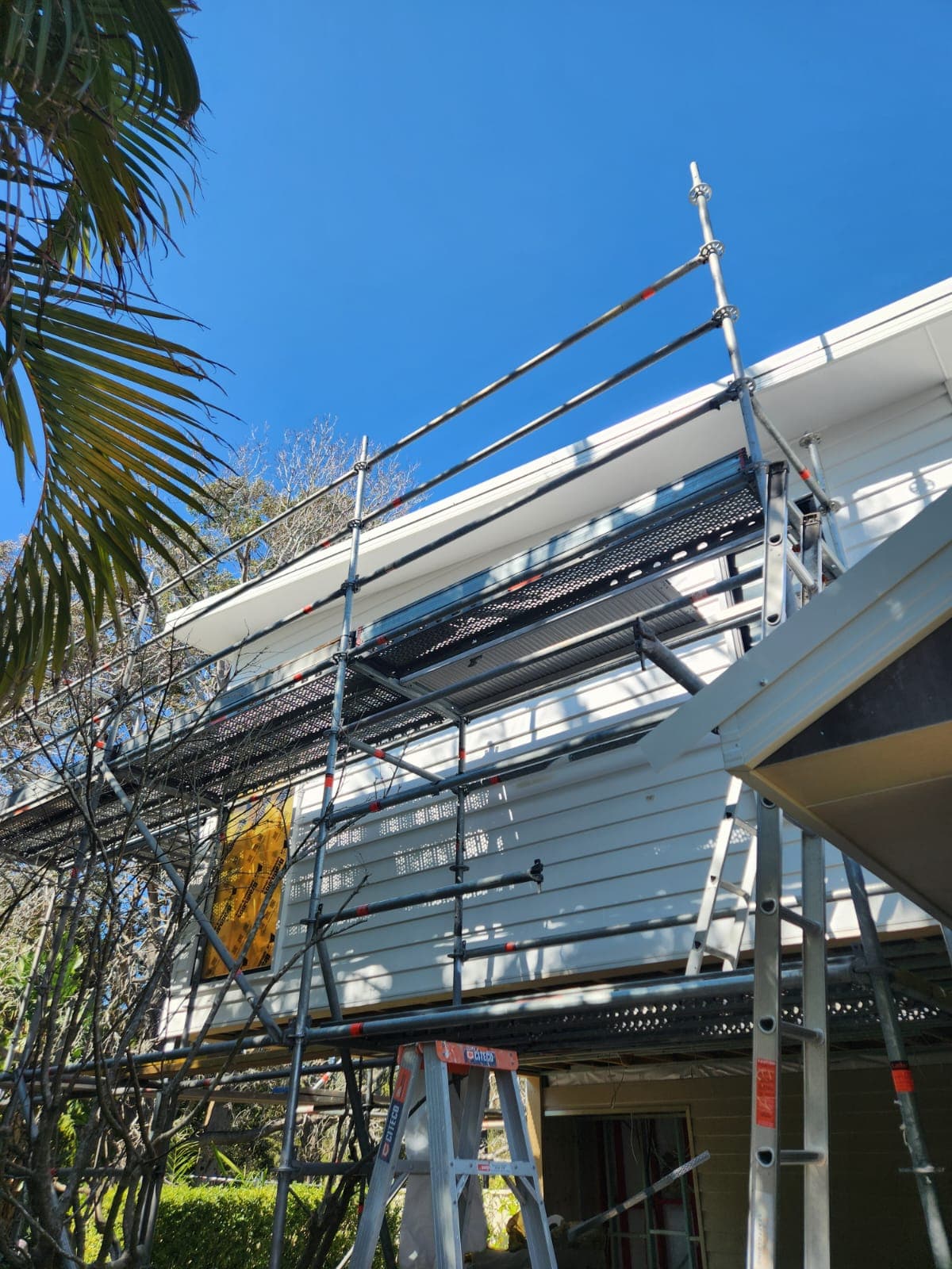 4 Elements Painting team — local painters in Newcastle working on a coastal home