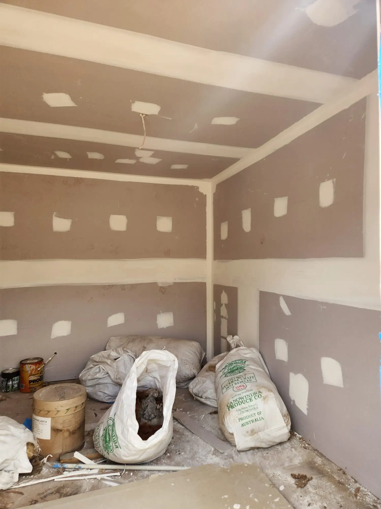 New-build interior prepared for painting with plasterboard walls